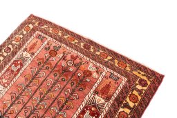 Surface texture of 1987s Baloch rug with natural Wool and intricate pattern