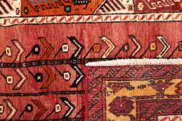 Close-up detail of 1987s Baloch rug from Iran / Persia showing Wool weave