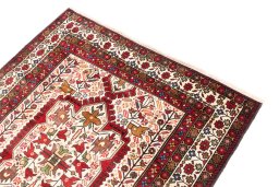 Surface texture of 1998s Baloch rug with natural Wool and intricate pattern