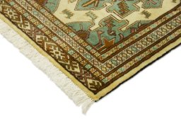 Backside of handmade 2000s Baloch rug showing knot structure and weave density