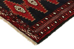 Backside of handmade 1990s Baloch rug showing knot structure and weave density