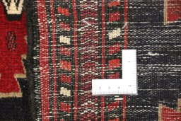 Close-up detail of 1990s Baloch rug from Iran / Persia showing Wool weave