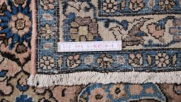 Corner detail of 1910s Dorokhsh rug showing border pattern and Wool pile