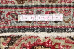 Corner detail of 1950s Dorokhsh rug showing border pattern and Wool pile