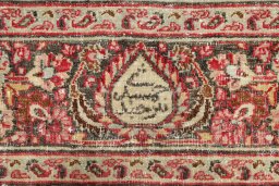 Backside of handmade 1950s Dorokhsh rug showing knot structure and weave density