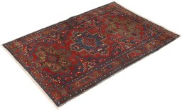 Corner detail of 1920s Gharajeh rug showing border pattern and Wool pile