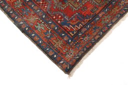 Backside of handmade 1920s Gharajeh rug showing knot structure and weave density