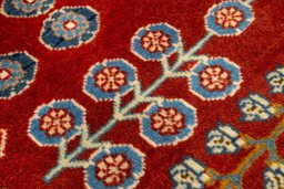 Backside of handmade New Ghashghai rug showing knot structure and weave density
