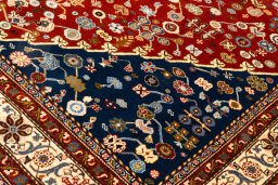 Backside of handmade New Ghashghai rug showing knot structure and weave density