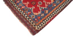 Backside of handmade 1940s Ghashghai rug showing knot structure and weave density