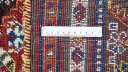 Full view of 1940s Ghashghai rug from Iran / Persia, 275 × 180 cm in Dark red tones