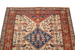 Surface texture of 2000s Ghashghai rug with natural Wool and intricate pattern