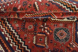 Corner detail of 2000s Ghashghai rug showing border pattern and Wool pile