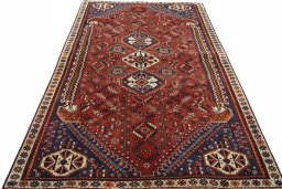 Surface texture of 2000s Ghashghai rug with natural Wool and intricate pattern