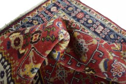 Corner detail of 2000s Ghashghai rug showing border pattern and Wool pile