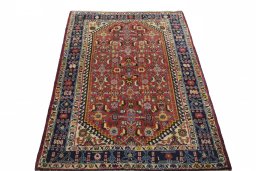 Surface texture of 2000s Ghashghai rug with natural Wool and intricate pattern