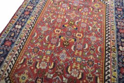 Backside of handmade 2000s Ghashghai rug showing knot structure and weave density