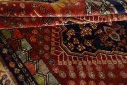 Corner detail of 2000s Ghashghai rug showing border pattern and Wool pile