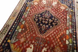 Backside of handmade 2000s Ghashghai rug showing knot structure and weave density