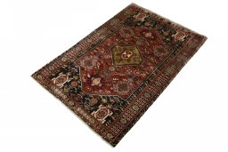 Corner detail of 2000s Ghashghai rug showing border pattern and Wool pile