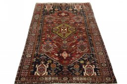 Surface texture of 2000s Ghashghai rug with natural Wool and intricate pattern