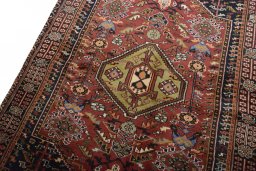 Backside of handmade 2000s Ghashghai rug showing knot structure and weave density