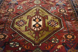 Central medallion detail of 2000s Ghashghai rug from Iran / Persia