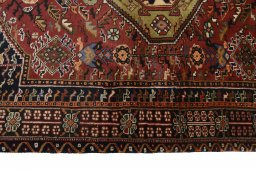 Full view of 2000s Ghashghai rug from Iran / Persia, 158 × 108 cm in Red tones