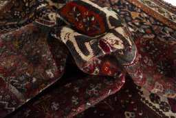 Corner detail of 2000s Ghashghai rug showing border pattern and Wool pile
