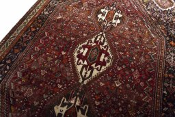 Backside of handmade 2000s Ghashghai rug showing knot structure and weave density