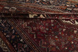 Full view of 2000s Ghashghai rug from Iran / Persia, 296 × 185 cm in Red tones