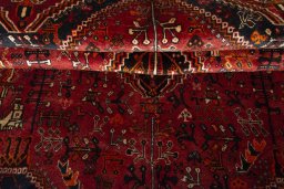 Corner detail of 2000s Ghashghai rug showing border pattern and Wool pile