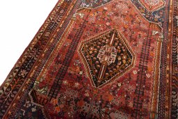 Backside of handmade 2000s Ghashghai rug showing knot structure and weave density