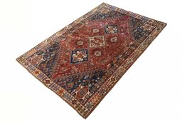 Corner detail of 2000s Ghashghai rug showing border pattern and Wool pile