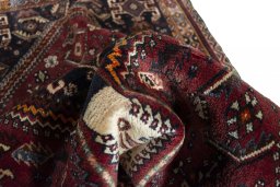 Corner detail of 2000s Ghashghai rug showing border pattern and Wool pile