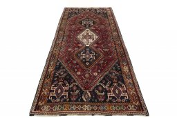 Surface texture of 2000s Ghashghai rug with natural Wool and intricate pattern
