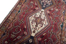 Backside of handmade 2000s Ghashghai rug showing knot structure and weave density