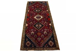 Surface texture of 2000s Ghashghai rug with natural Wool and intricate pattern