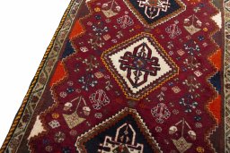 Backside of handmade 2000s Ghashghai rug showing knot structure and weave density