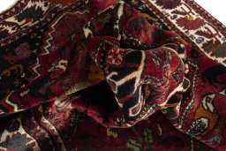 Corner detail of 2000s Ghashghai rug showing border pattern and Wool pile