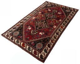 Corner detail of 2000s Ghashghai rug showing border pattern and Wool pile