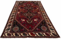 Surface texture of 2000s Ghashghai rug with natural Wool and intricate pattern