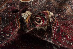 Corner detail of 2000s Ghashghai rug showing border pattern and Wool pile