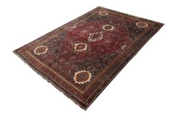 Corner detail of 2000s Ghashghai rug showing border pattern and Wool pile