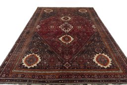 Surface texture of 2000s Ghashghai rug with natural Wool and intricate pattern