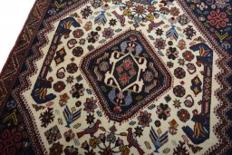 Backside of handmade 2000s Ghashghai rug showing knot structure and weave density
