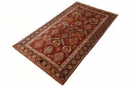 Corner detail of 2000s Ghashghai rug showing border pattern and Wool pile