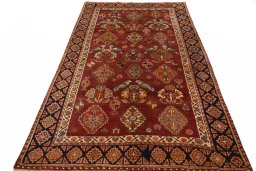 Surface texture of 2000s Ghashghai rug with natural Wool and intricate pattern