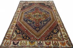 Surface texture of 2000s Ghashghai rug with natural Wool and intricate pattern