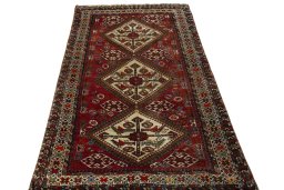 Surface texture of 1950s Ghashghai rug with natural Wool and intricate pattern